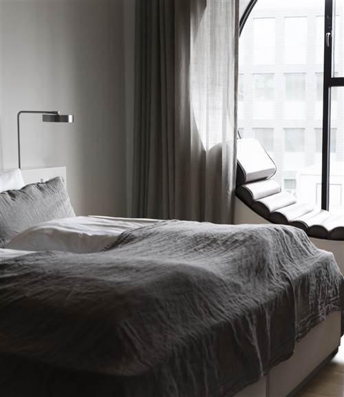 Hotel Ottilia Deluxe Room with Round Window - Minimalist Hotel Bedroom