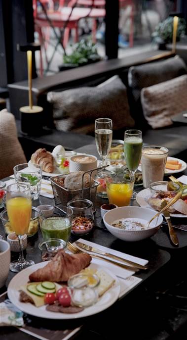 Hotel Breakfast Copenhagen - Breakfast Table with Pastries and Juices