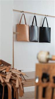 Brøchner Hotels Copenhagen - Leather Tote Bags Hanging On Rack