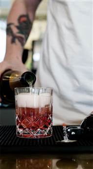 Bar & Rooftop Terrace Copenhagen - Pouring Sparkling Cocktail in Glass