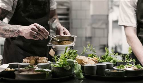Restaurant Vaekst Copenhagen - Chefs Plating Gourmet Dishes in Kitchen