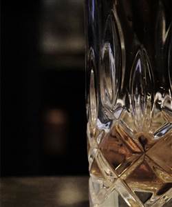 NightCap Hour Copenhagen - Whiskey in Cut Crystal Glass Closeup